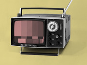Vintage Sony portable television with a pixelated censored image on screen, shown against a yellow background as editorial illustration.