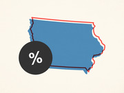 Editorial illustration of the state of Iowa in blue with a red outline and a dark circle bearing a percent sign, suggesting a story about Iowa polling or statistics.