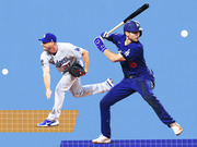 Editorial illustration of two Los Angeles Dodgers baseball players, a pitcher and a batter, on a blue background with decorative grid elements.