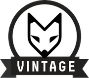 Black and white logo featuring a stylized fox face inside a circle with a banner reading VINTAGE below it.