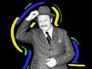 Black and white photo of a mustachioed man in a plaid suit tipping his hat, set against a black background with colorful blue, yellow, and green brushstroke swirls.