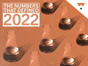 Editorial illustration with orange-tinted laboratory flasks and the text 'The Numbers That Defined 2022' for a FiveThirtyEight year-in-review feature.