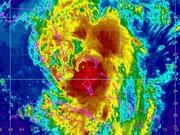 False-color infrared satellite image of a hurricane showing cloud temperature bands with latitude and longitude grid lines and pink coastline overlays.