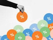 Editorial illustration of a hand picking up an orange circle with a percent sign from a pile of colorful circles all bearing percent symbols.