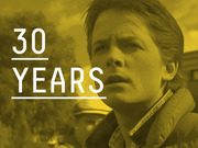 Yellow-tinted editorial image of a young man with text reading 30 Years, likely referencing the Back to the Future 30th anniversary.